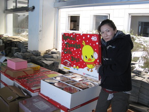 Our local partner in front of the donated goods