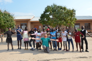 A volunteer with the children of Mampshe school