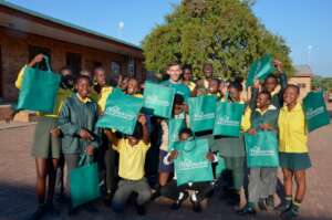 Students with the Outreach Manager at the school