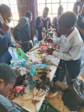 Students making their own Ecobrick