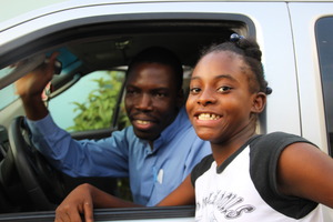Fr. Sadoni and Danika, a deaf student