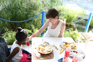 Kathy (TRTP President) feeding Dayana at Camp Jake