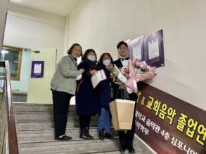 Minyeol w/ the house mothers who helped raise him