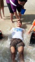 Daniel enjoying the rush of warm seawater.