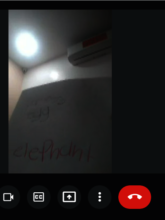 Charles is writing words and show to camera