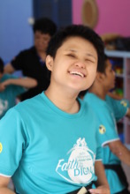 Enn is happily listening to the music playing.