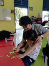 She loves to play with clay while learning