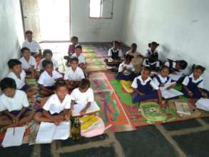 Classroom- children sitting on mats