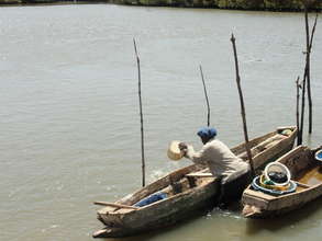 Oyster Harvester with Canoe