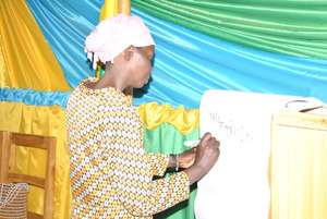 A woman writing on the flip chart