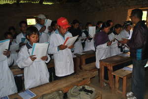 Singing the Little Doctors song with their teacher