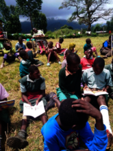 Pupils at Irindiro reading at break time