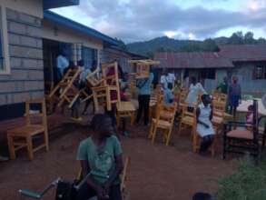 The new furniture being installed in the classroom