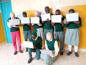 St Lucy's students with the refurbished laptops