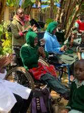 Children at Irindiro School with new wheelchairs