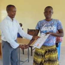 Maureeen receives her student certificate