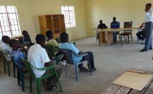 The guest of honour speaks to the group