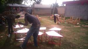 Steven painting the table tops