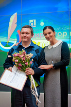 Dr Max Anikeev receiving the best Directors award