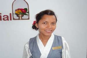 Manisha at the desk of the Summit Hotel