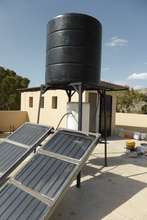 Solar tiles and water heater, installed on roof