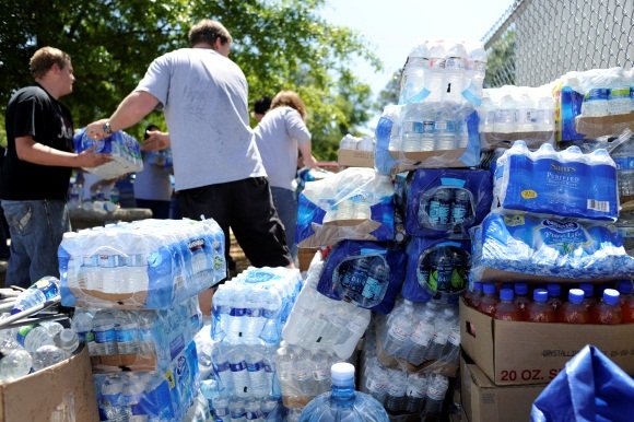 Volunteers unload water in Tuscaloosa, Alabama