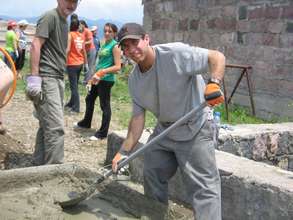 volunteers making the concrete floors