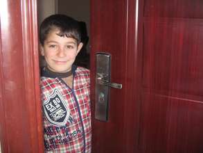 the elder son a the house entrance