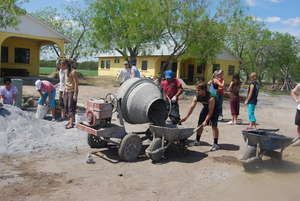 College students mixing concrete