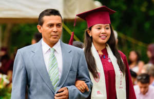 Jacqueline with her father on graduation day.