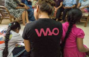 WAO Social Worker Reading to kids in the Shelter