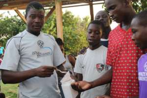 Coach Elbrane lines up his boys team for deworming