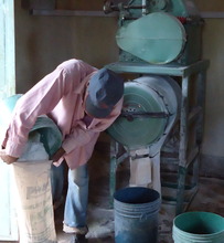 Charles Maina milling his cassava
