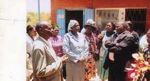 Community members gathering for visit
