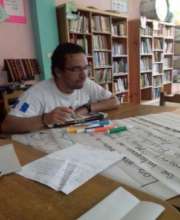 Young volunteer at library