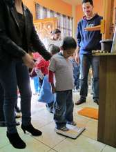 Each child is weighed and measured each week.