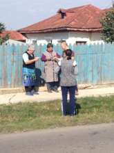 Dr Aurelian handing out deparasite products