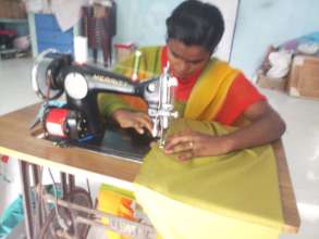 Mamta learning to stitch