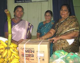 staff of YWCA donating fruits and provision toHOME