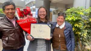 PH scholar, Aldy, with her parents and her degree.