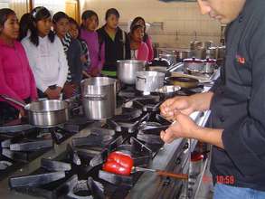 Peruvian Promise girls watch chefs at work