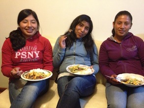 Lucero, Ana, and Elizabeth share dinner together.