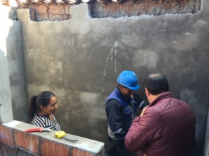 Epi checks on the progress of the new bathroom