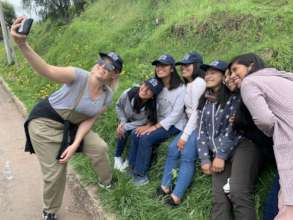 Kelsey takes a selfie with a group of PH scholars