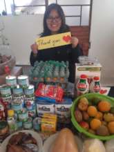 Maite shows products that her family purchased.