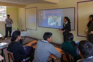Maribel presents to a class about leadership.