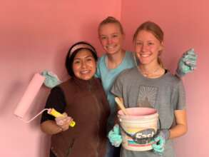 PH Scholar, Ruth Katherine, with two volunteers.
