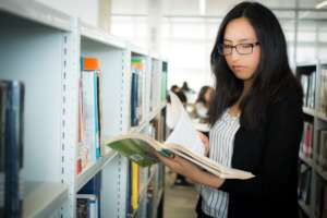 PH Scholar, Maribel, at the PUCP Library in Lima.