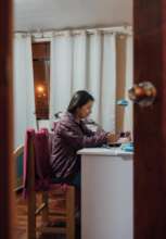 PH Scholar, Gloria, studying for an exam.