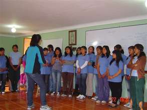 PP girls take part in an activity at a meeting.
